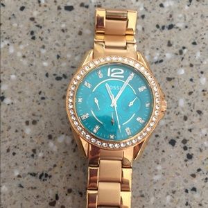 Fossil rose gold watch with teal face